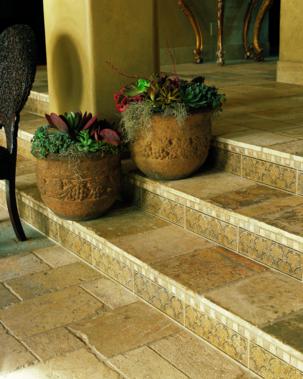This Tuscan tiled stair case features a rustic look that captures an old world feel. The etched border lining the steps create an added detail of elegance to this tumbled stone stair case.